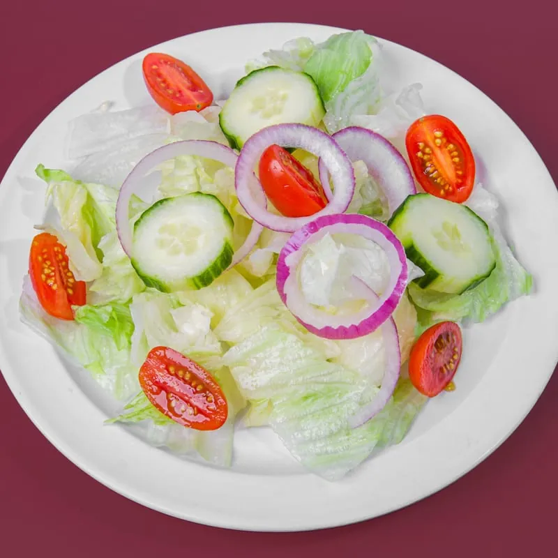 House salad with tomatoes, red onions and cucumbers