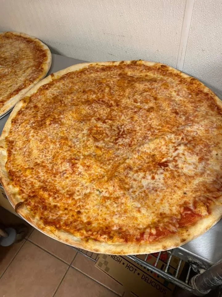 Whole cheese pizza fresh from the oven